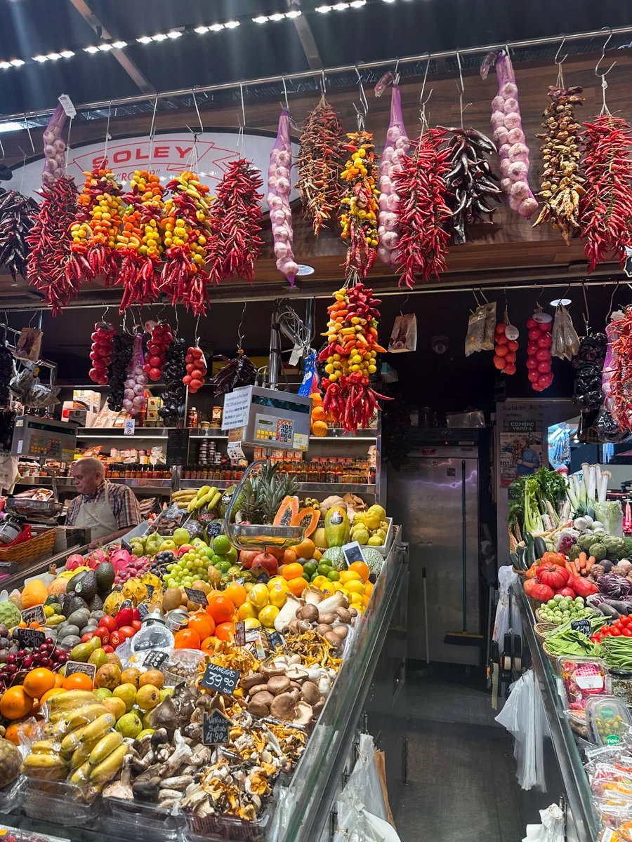 lots of chilis and other produce in the barcelona food market la boqueria