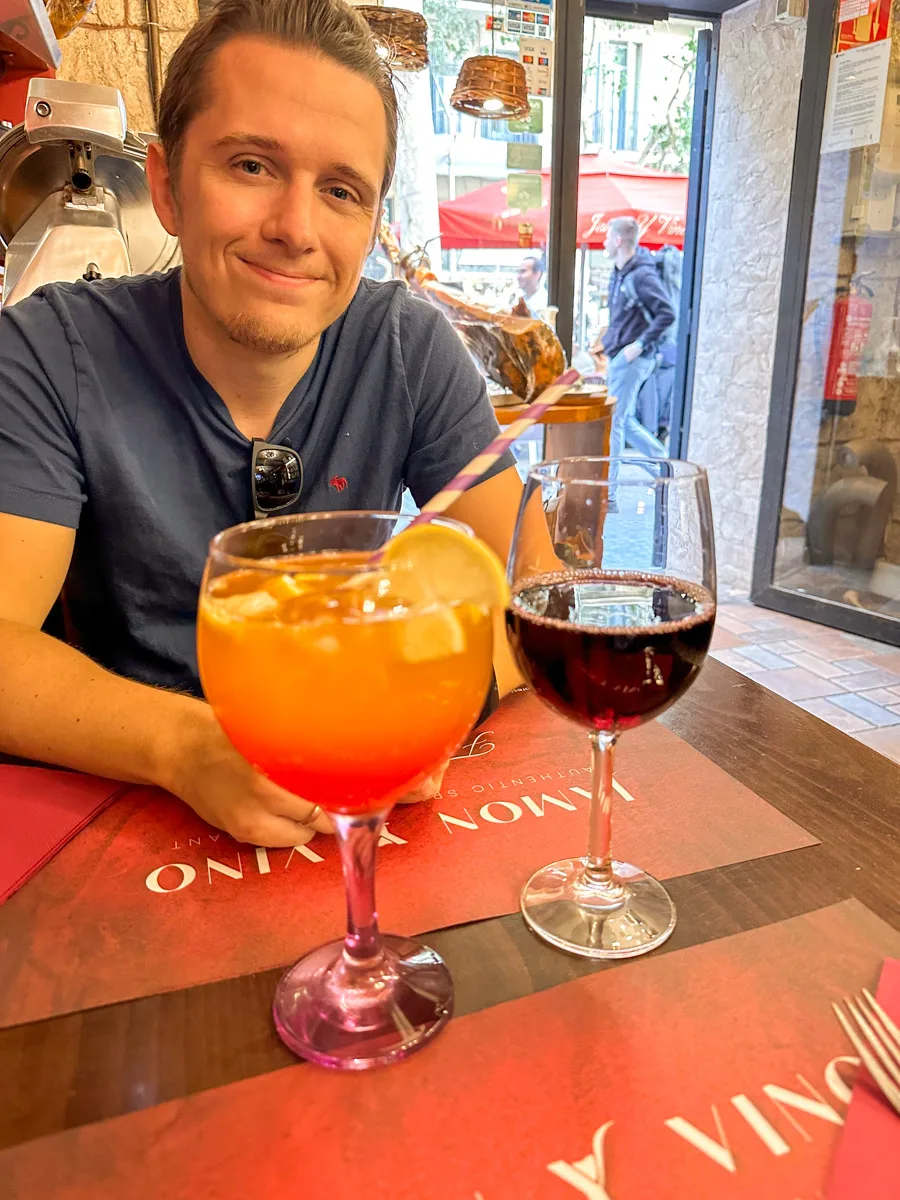 a young guy enjoying some drinks in Barcelona