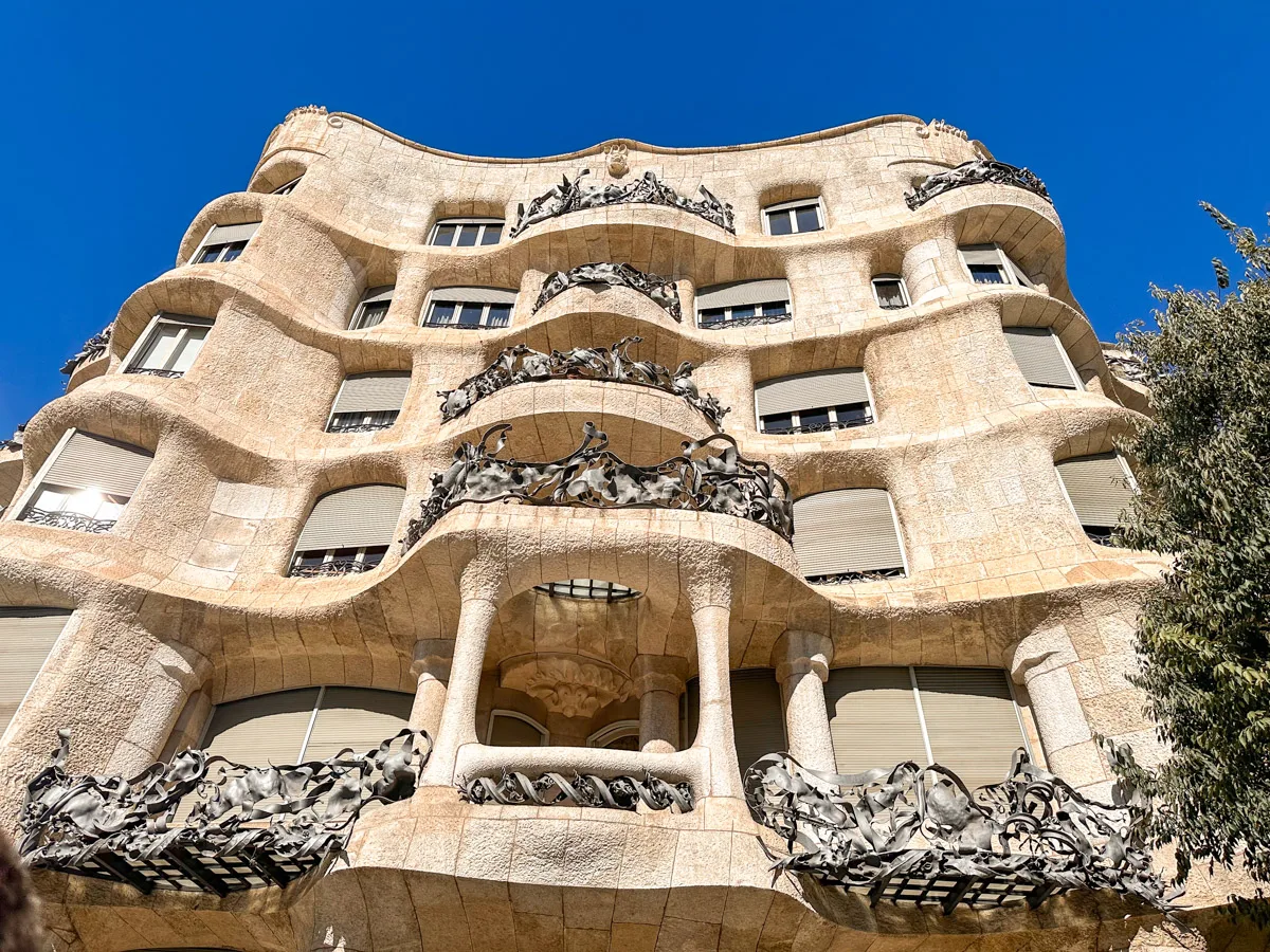 Stunning facade of the casa Mila in Barcelona, a cool gaudi archtiectural piece that you should visit alone in Barcelona