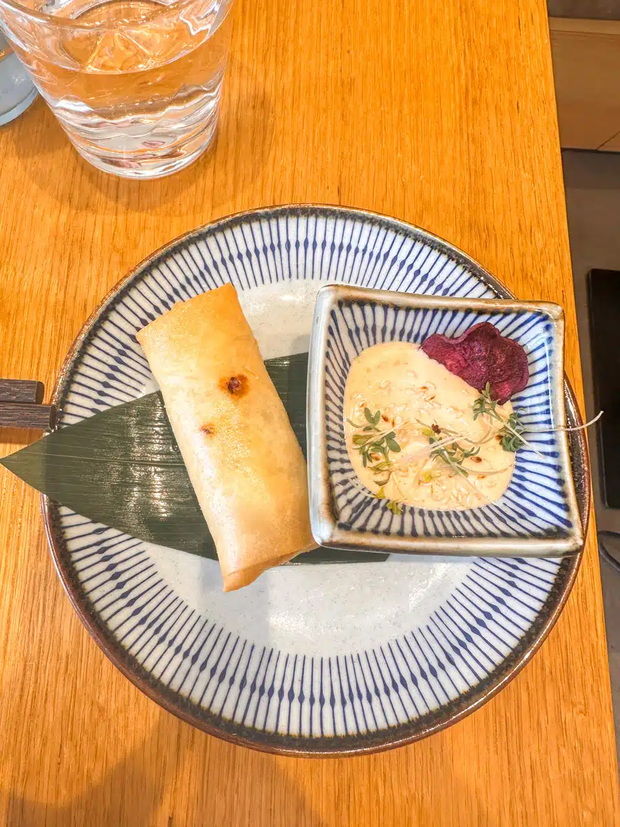 Delicious springroll decorated with fancy banana leafs in a restaurant in Vienna, showing that the Austrian kitchen makes the country worth visiting.